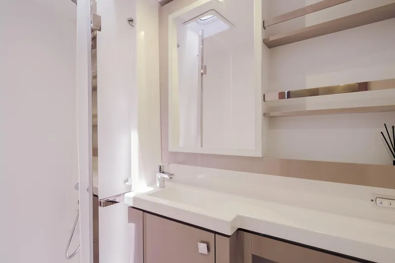 Slide: The Image of Modern bathroom interior on 2020 Fountaine Pajot Saona 47 yacht, featuring sleek design and fixtures. - 62