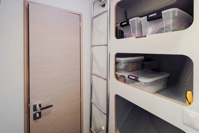 Slide: The Image of Storage area inside 2020 Fountaine Pajot Saona 47 yacht with organized safety equipment. - 63
