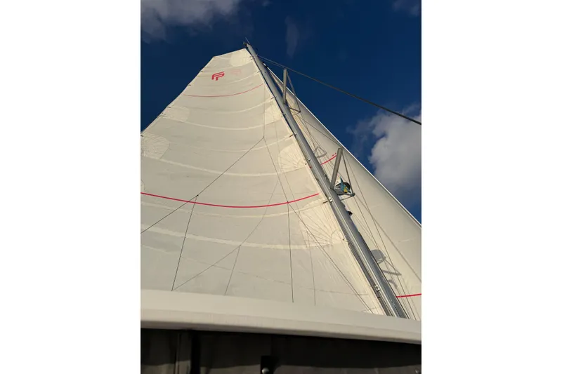 Slide: The Image of Sail of 2020 Fountaine Pajot Saona 47 catamaran against a clear blue sky. - 72