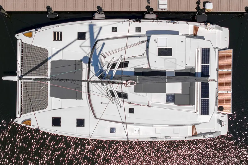 Slide: The Image of Aerial view of 2020 Fountaine Pajot Saona 47 catamaran docked at a marina. - 8