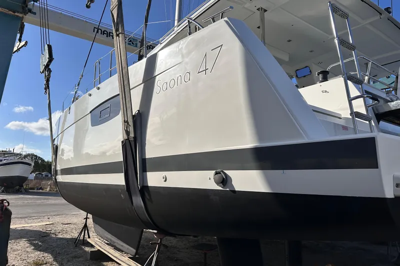 Slide: The Image of 2020 Fountaine Pajot Saona 47 catamaran in dry dock, side view. - 83