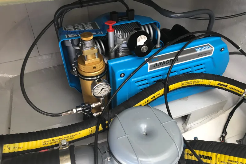 Slide: The Image of Bauer Junior II compressor in a 2020 Fountaine Pajot Saona 47 yacht engine room. - 89
