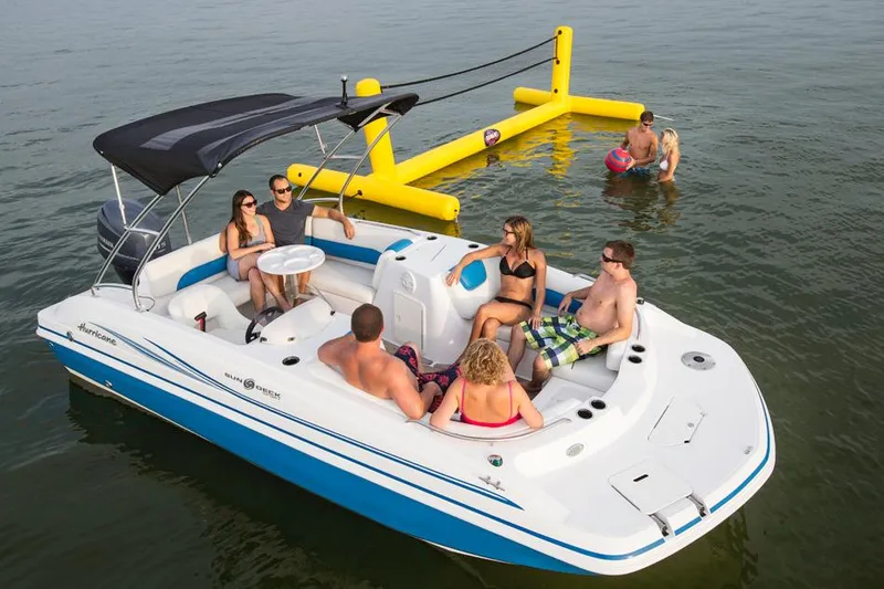 Slide: The Image of Manufacturer Provided Image: 2014 Hurricane SunDeck Sport 188 OB boat with people enjoying water activities. - 4