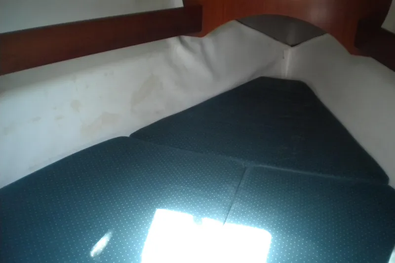 Slide: The Image of Interior cabin of 1994 Beneteau First 310 sailboat with cushioned berth. - 13