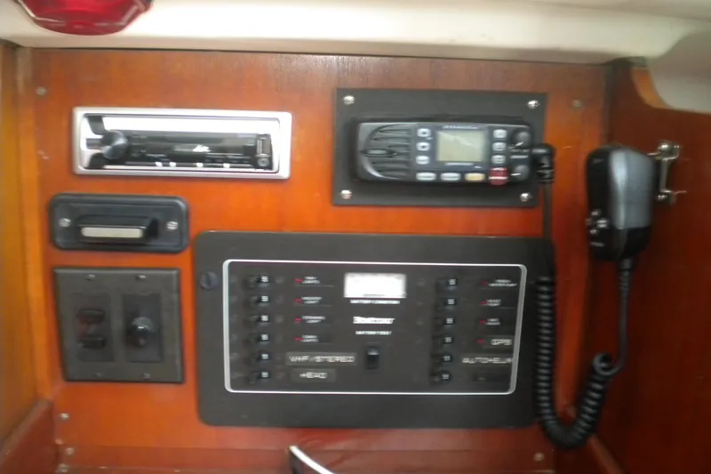 Slide: The Image of Control panel of a 1994 Beneteau First 310 sailboat with radio and switches. - 21