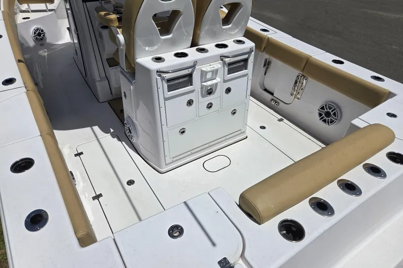 Slide: The Image of 2025 Sportsman Open 262 Center Console boat interior with seating and storage compartments. - 11