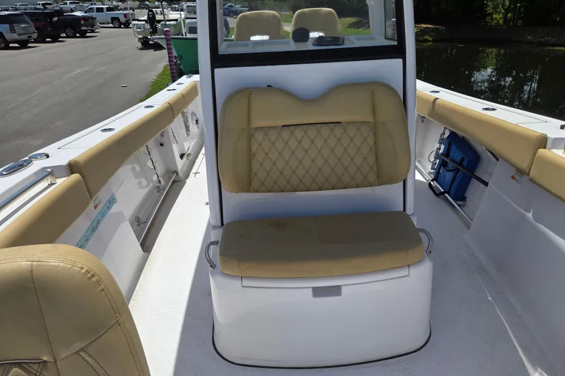 Slide: The Image of 2025 Sportsman Open 262 Center Console boat interior with tan seating and console. - 15