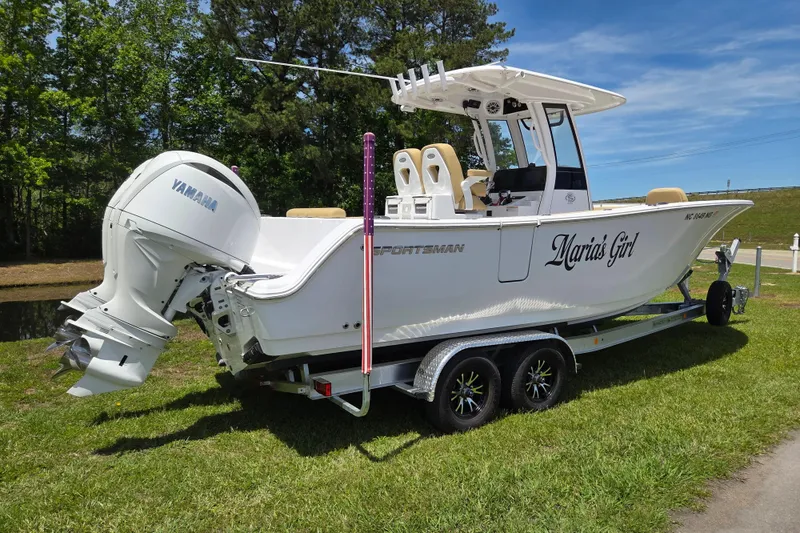 Slide: The Image of 2025 Sportsman Open 262 Center Console boat on trailer, featuring Yamaha engine. - 2