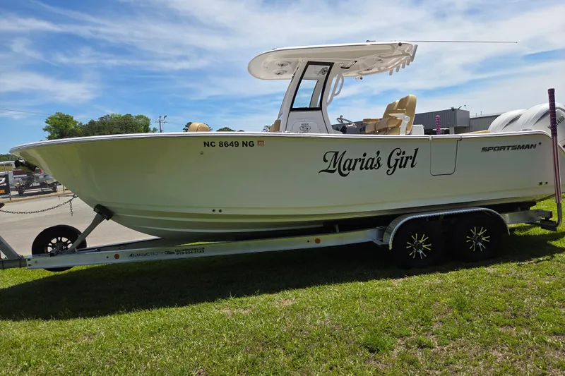 Slide: The Image of 2025 Sportsman Open 262 Center Console boat on trailer, named "Maria's Girl." - 6