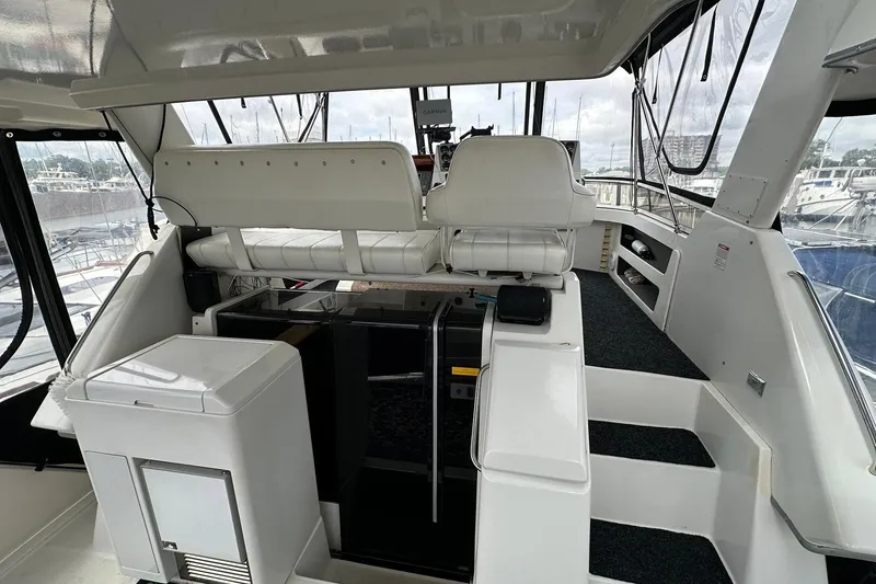 Slide: The Image of 1997 Carver 355 Aft Cabin Motor Yacht interior with helm and seating area. - 10