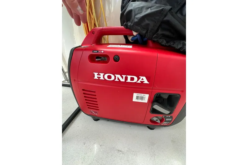 Slide: The Image of Red Honda portable generator on a 1997 Carver 355 Aft Cabin Motor Yacht. - 11