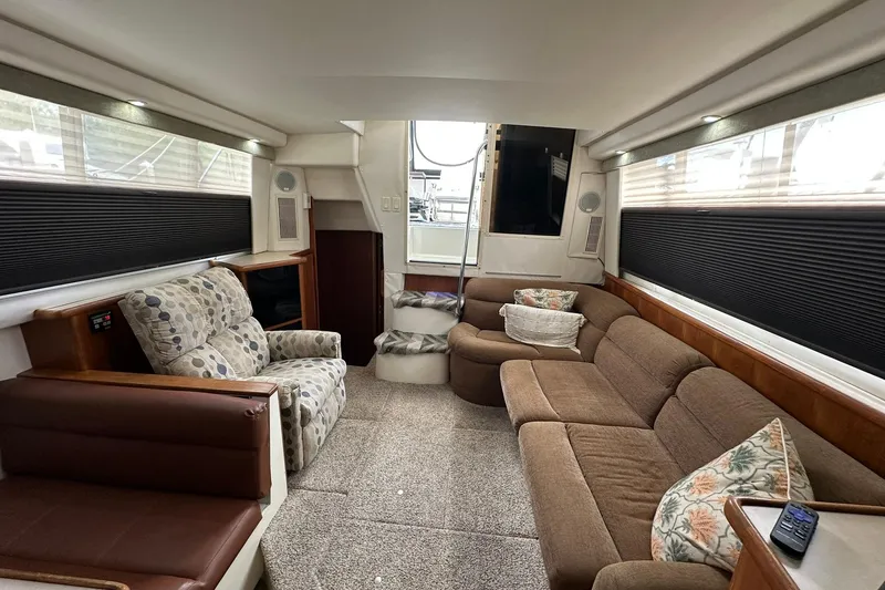Slide: The Image of Interior of 1997 Carver 355 Aft Cabin Motor Yacht with cozy seating and modern decor. - 23