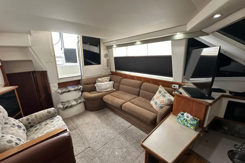 Slide: The Image of Interior of 1997 Carver 355 Aft Cabin Motor Yacht with cozy seating and modern amenities. - 24