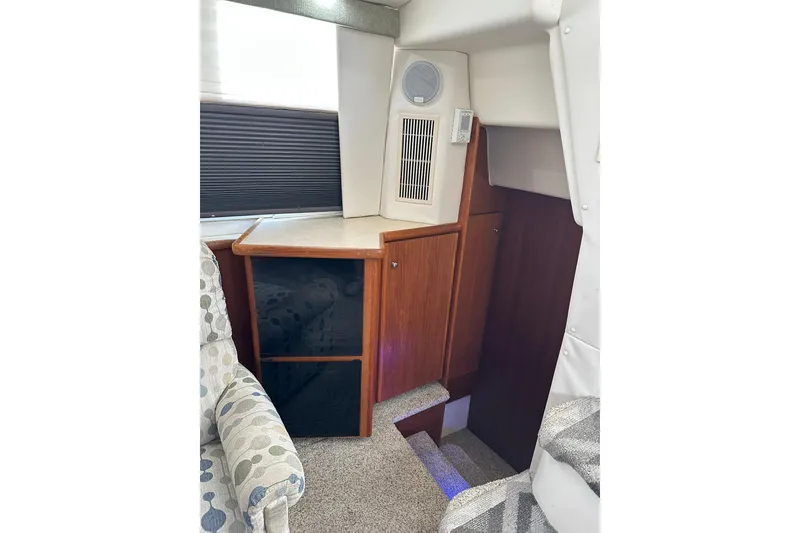 Slide: The Image of Interior of 1997 Carver 355 Aft Cabin Motor Yacht with stairs and wooden cabinetry. - 27