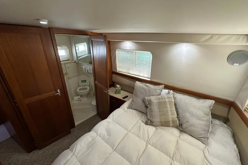 Slide: The Image of Cozy bedroom and bathroom in 1997 Carver 355 Aft Cabin Motor Yacht. - 29