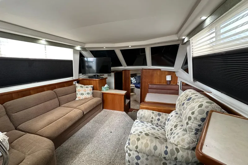 Slide: The Image of Luxurious interior of 1997 Carver 355 Aft Cabin Motor Yacht with cozy seating and modern amenities. - 33