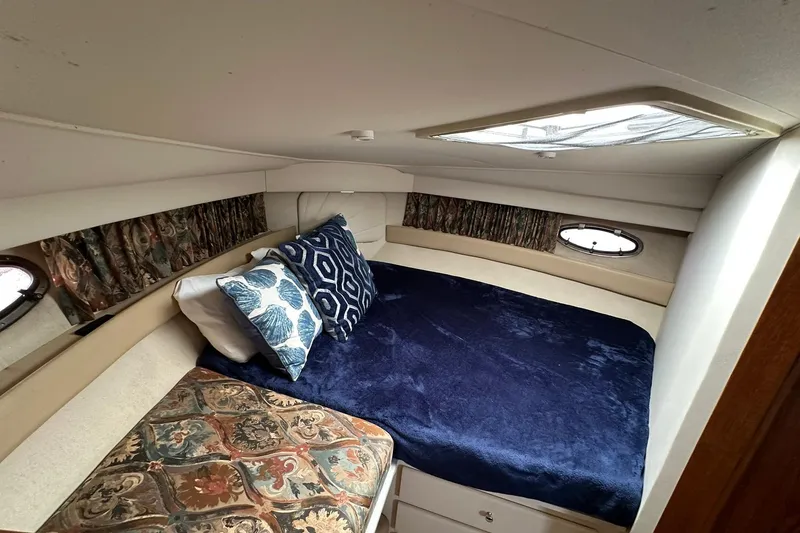 Slide: The Image of 1997 Carver 355 Aft Cabin Motor Yacht bedroom with cozy bedding and decorative pillows. - 38