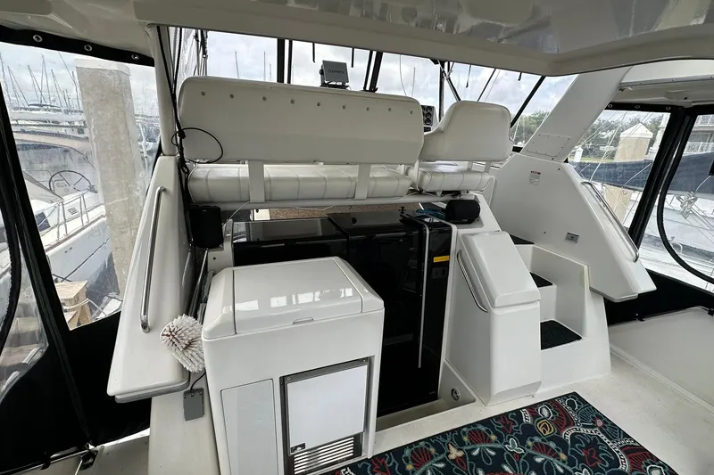 Slide: The Image of 1997 Carver 355 Aft Cabin Motor Yacht interior with helm and seating area. - 8