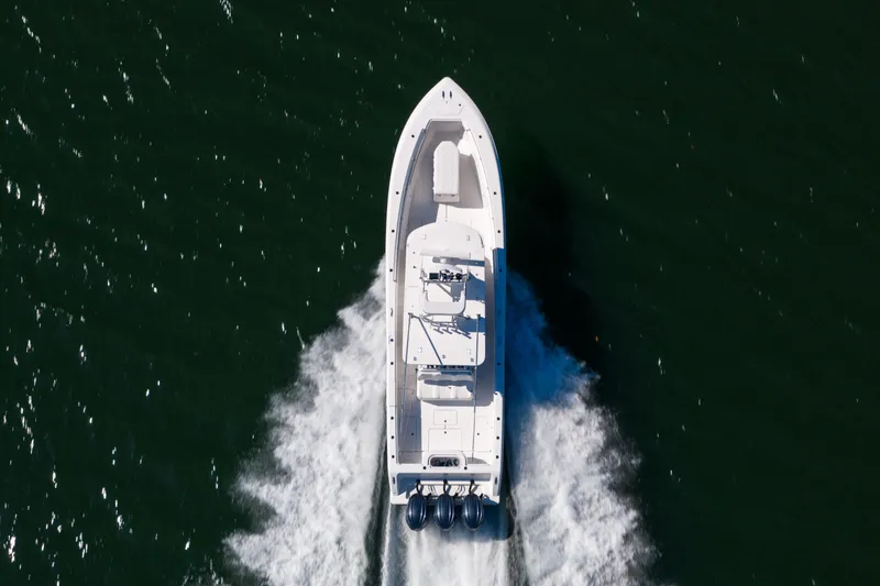 Slide: The Image of Aerial view of 2015 Invincible 39 Open Fisherman boat cruising on water. - 12
