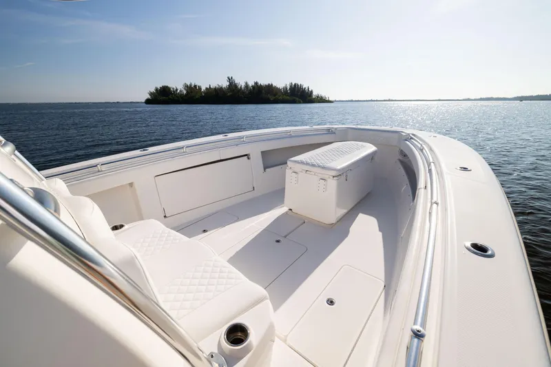 Slide: The Image of 2015 Invincible 39 Open Fisherman boat on calm water, sunny day. - 14