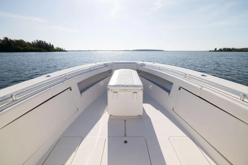 Slide: The Image of 2015 Invincible 39 Open Fisherman boat on calm water, sunny day. - 15