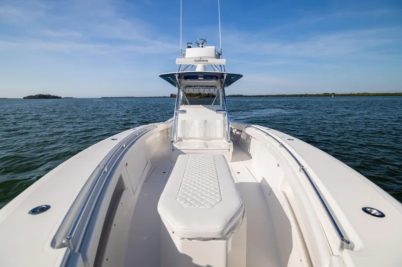 Slide: The Image of 2015 Invincible 39 Open Fisherman boat cruising on open water. - 16