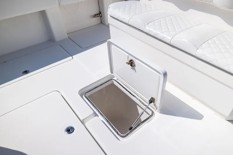 Slide: The Image of 2015 Invincible 39 Open Fisherman boat deck with open storage compartment. - 22