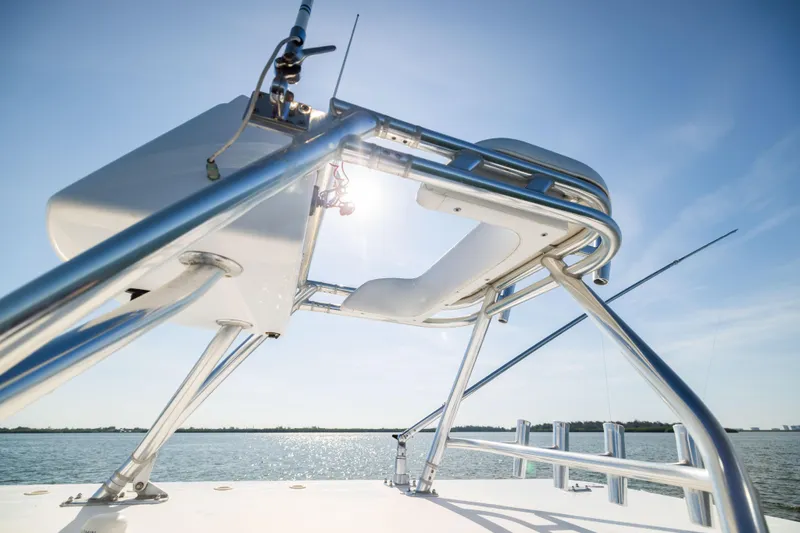 Slide: The Image of 2015 Invincible 39 Open Fisherman boat, sleek metal structure, sunny day on the water. - 35