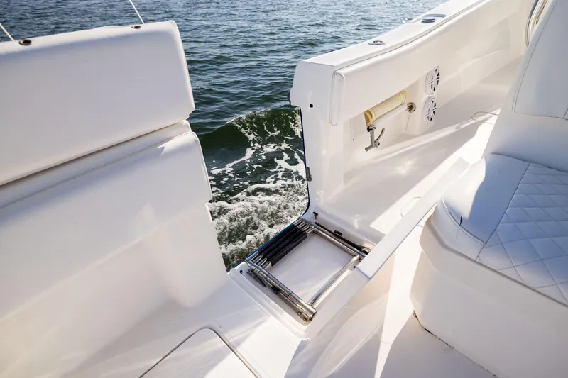 Slide: The Image of 2015 Invincible 39 Open Fisherman boat interior with ladder and ocean view. - 42