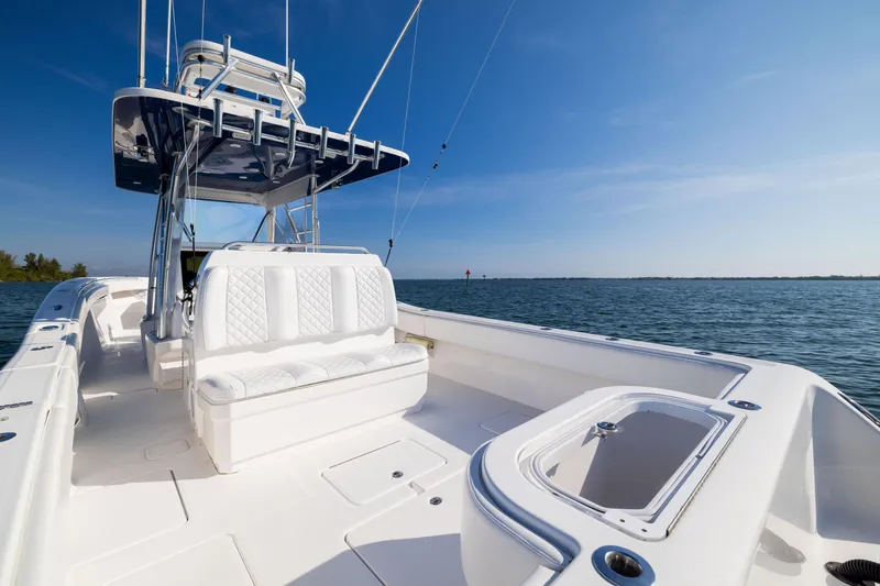 Slide: The Image of 2015 Invincible 39 Open Fisherman boat on calm waters under clear blue sky. - 43