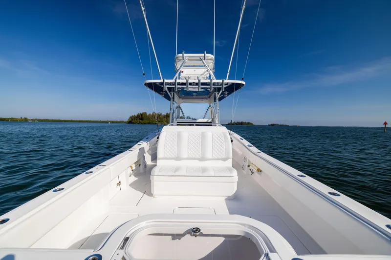 Slide: The Image of 2015 Invincible 39 Open Fisherman boat on calm blue waters under clear sky. - 44