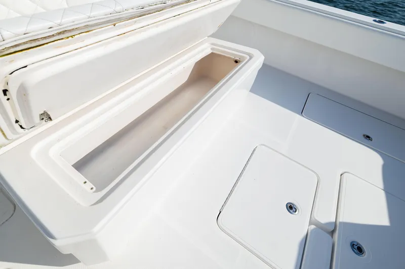 Slide: The Image of Open storage compartment on 2015 Invincible 39 Open Fisherman boat deck. - 47