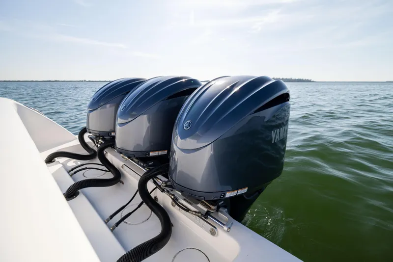 Slide: The Image of Triple Yamaha outboard engines on a 2015 Invincible 39 Open Fisherman boat. - 51