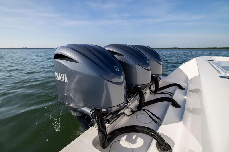 Slide: The Image of 2015 Invincible 39 Open Fisherman with Yamaha outboard engines on calm water. - 52
