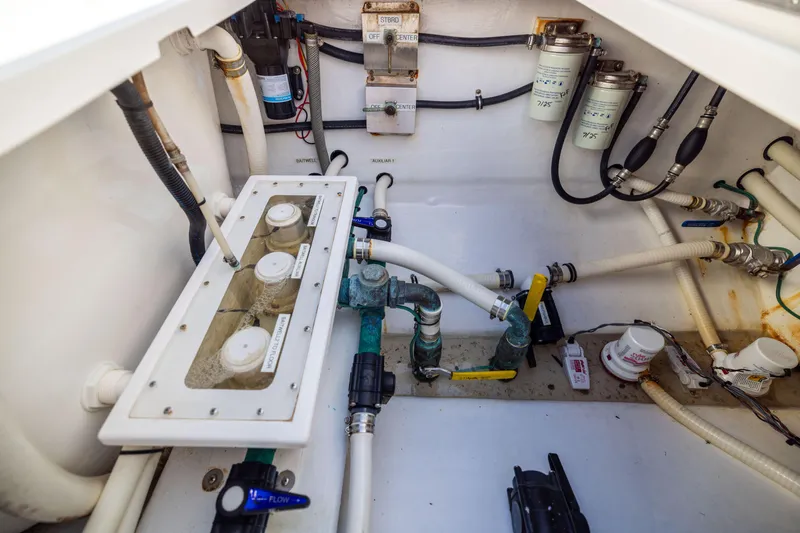 Slide: The Image of 2015 Invincible 39 Open Fisherman boat plumbing and filtration system. - 53