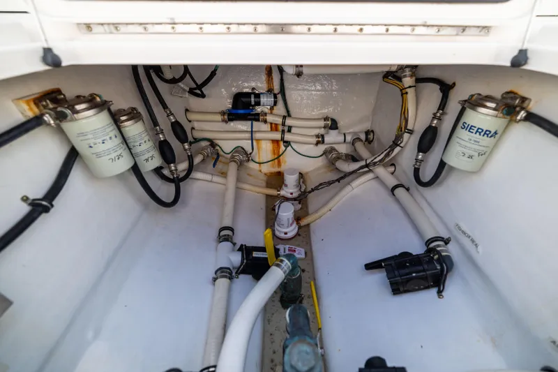 Slide: The Image of Bilge area of 2015 Invincible 39 Open Fisherman with fuel filters and hoses. - 55