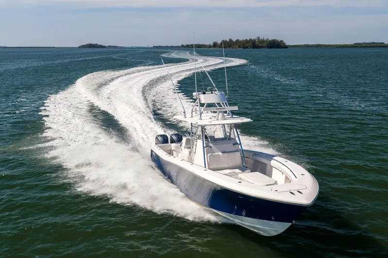 Slide: The Image of 2015 Invincible 39 Open Fisherman speeding on open water, leaving a wake trail. - 59