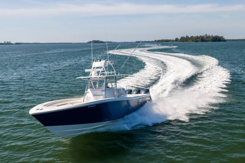 Slide: The Image of 2015 Invincible 39 Open Fisherman speeding on open water, leaving a wake trail. - 60