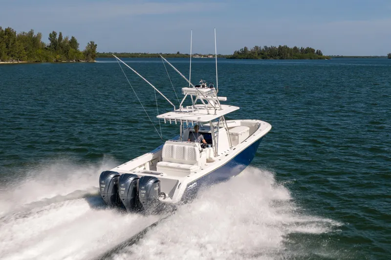 Slide: The Image of 2015 Invincible 39 Open Fisherman boat cruising on open water. - 8