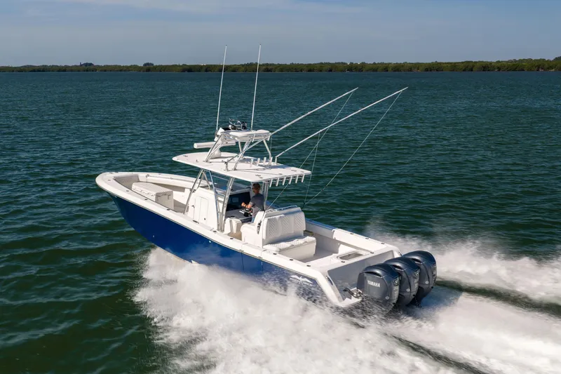 Slide: The Image of 2015 Invincible 39 Open Fisherman boat cruising on open water. - 9
