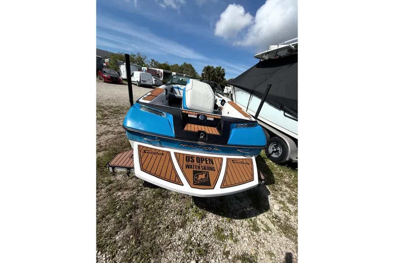Slide: The Image of 2015 Nautique Ski Nautique 200 Open Bow boat with US Open Waterskiing branding. - 4