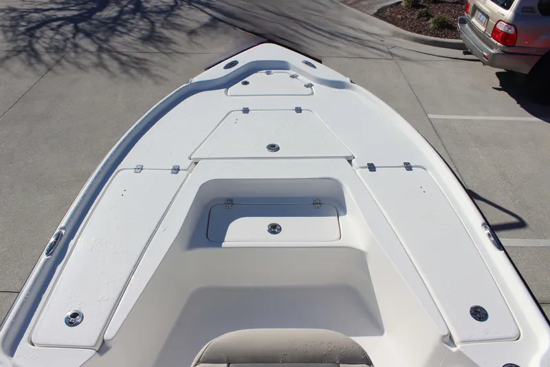 Slide: The Image of 2026 Key West 210 Bay Reef boat deck with storage compartments. - 11