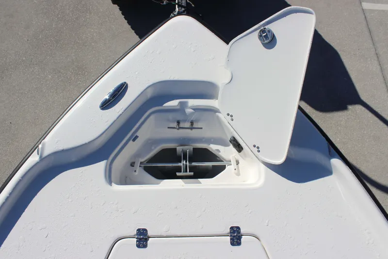 Slide: The Image of Open storage compartment on 2026 Key West 210 Bay Reef boat deck. - 12