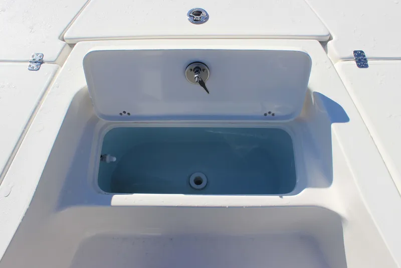 Slide: The Image of Livewell on 2026 Key West 210 Bay Reef boat, open lid, white interior. - 14