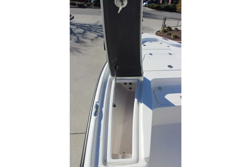 Slide: The Image of 2026 Key West 210 Bay Reef boat storage compartment open on deck. - 16