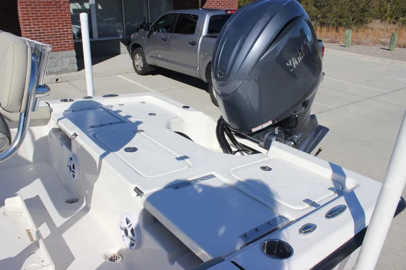 Slide: The Image of 2026 Key West 210 Bay Reef boat with Yamaha outboard motor in a parking lot. - 20