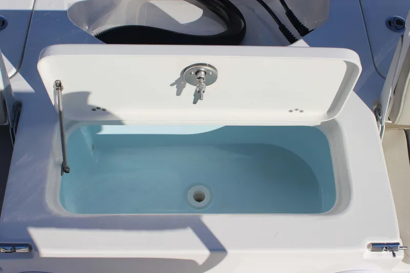 Slide: The Image of Open livewell on 2026 Key West 210 Bay Reef boat, showcasing interior design. - 22