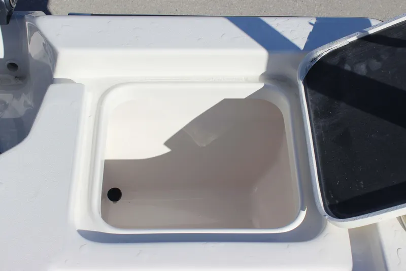 Slide: The Image of Open storage compartment on 2026 Key West 210 Bay Reef boat. - 23