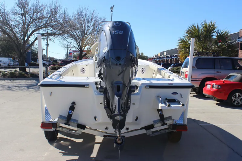 Slide: The Image of 2026 Key West 210 Bay Reef boat with Yamaha 150 engine, parked outdoors. - 6