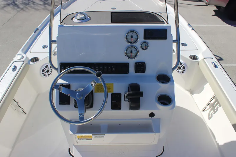Slide: The Image of 2026 Key West 210 Bay Reef boat console with steering wheel and gauges. - 7